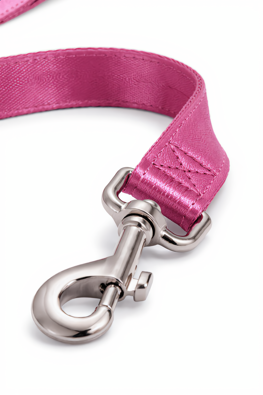 Pink dog leash with silver clasp on a white background