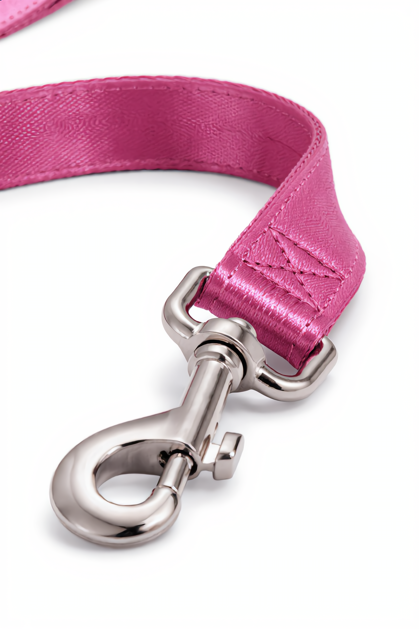 Pink dog leash with silver clasp on a white background