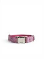 Pink glittery dog collar with a silver buckle on a white background