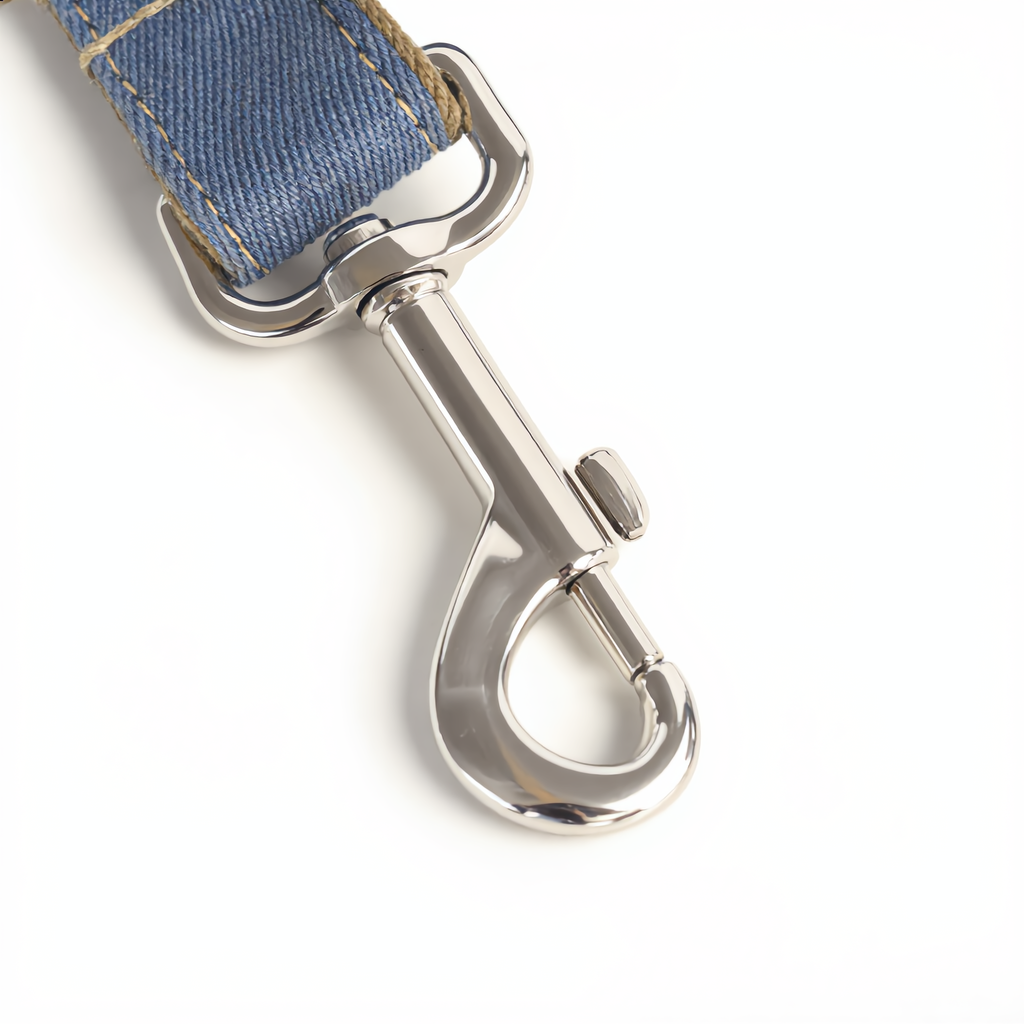 Dog leash with blue fabric and silver metal clip on a white background