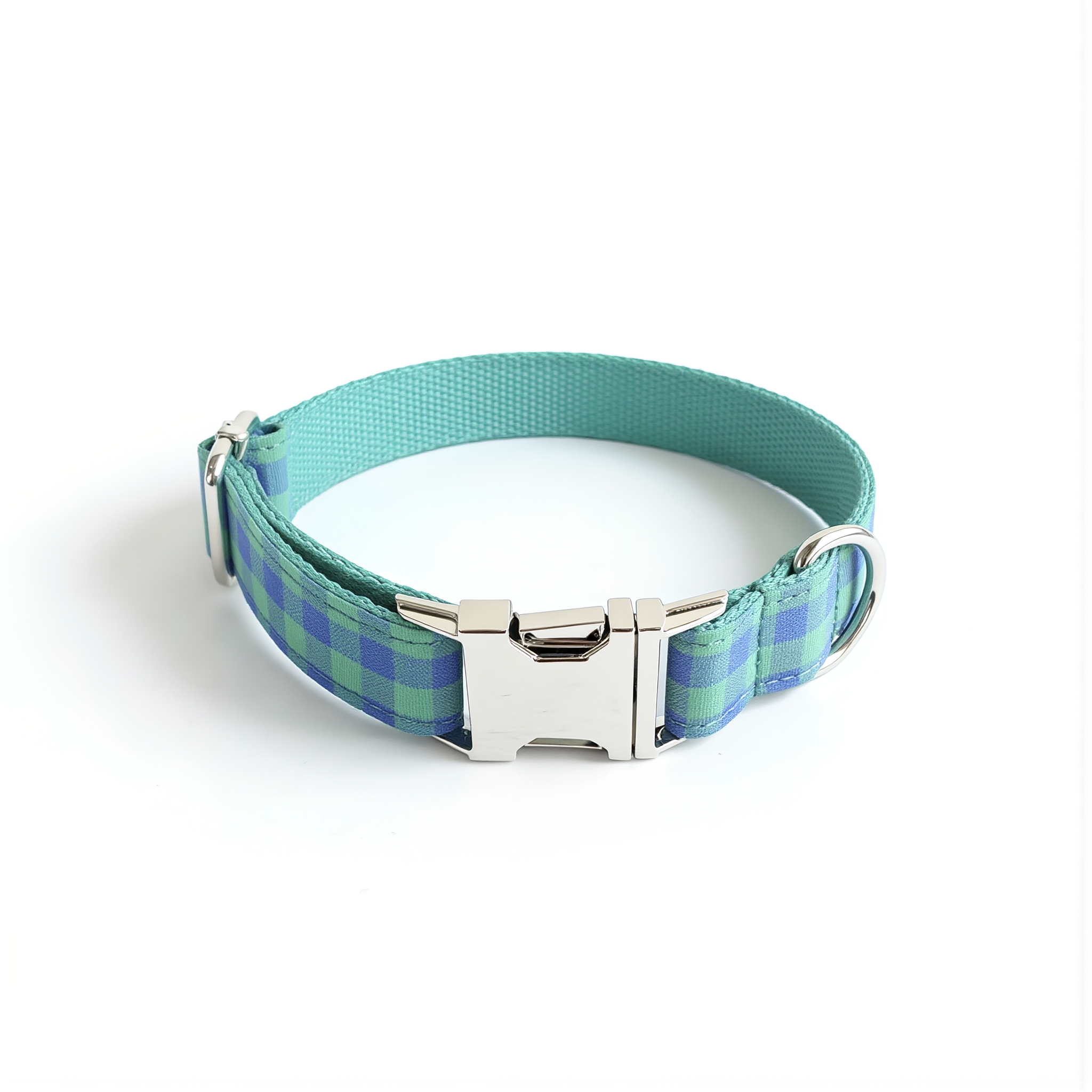 Plaid dog collar with a silver buckle on a white background